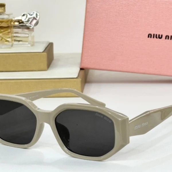Retro-inspired Miu Miu sunglasses blending vintage curves with bold branding