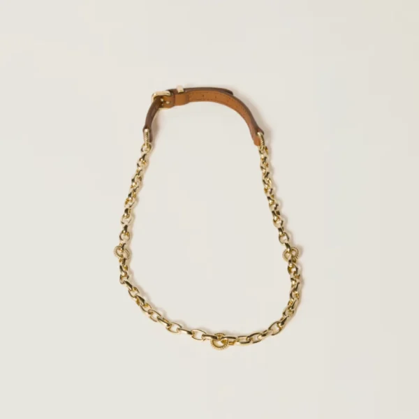 Miu Miu necklace featuring sleek metal hardware and black leather strap