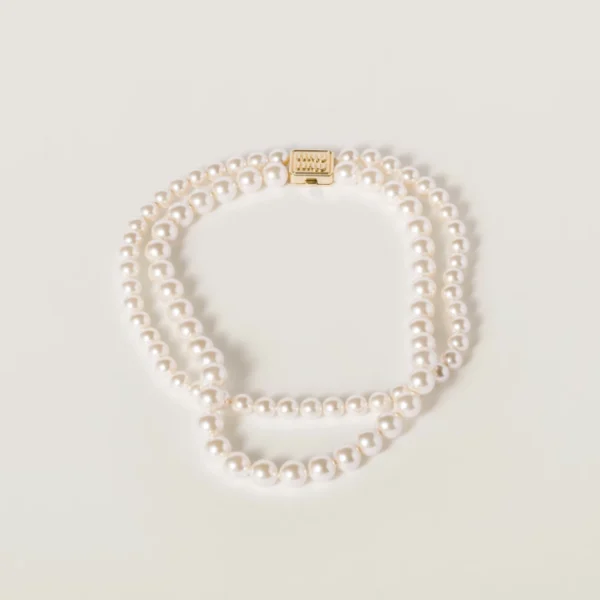 Miu Miu necklace with gold-tone metal and cream pearls in an elegant design