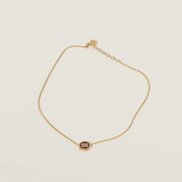 Miu Miu metal necklace in vibrant amaranth red and maize yellow colors with sleek design