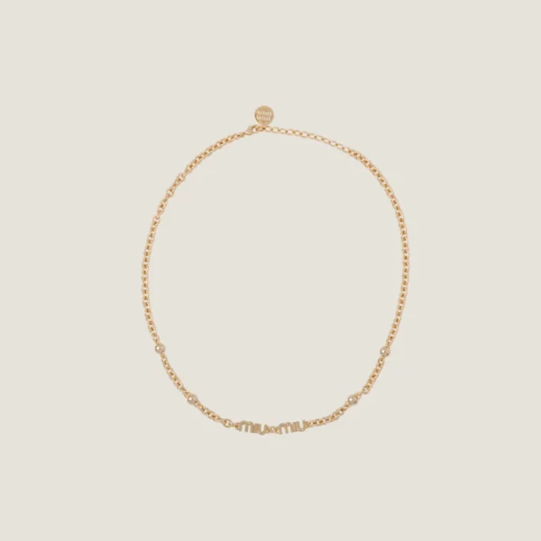 Close-up of Miu Miu necklace crafted from silver-tone or gold-tone metal