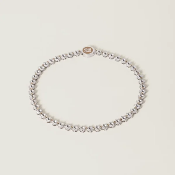 Miu Miu metal necklace adorned with sparkling crystals and polished finish