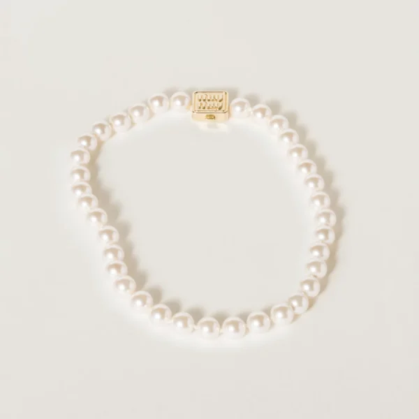Miu Miu metal necklace featuring synthetic pearls and polished gold-tone finish