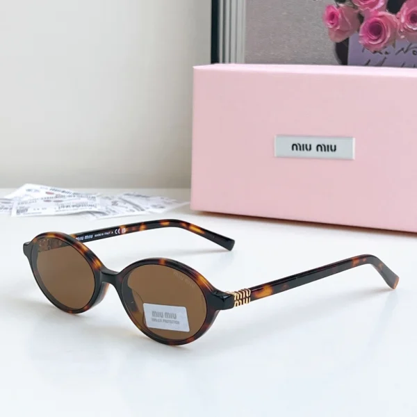 MiuMiu Miu Regard sunglasses featuring bold oversized frame and gradient tinted lenses