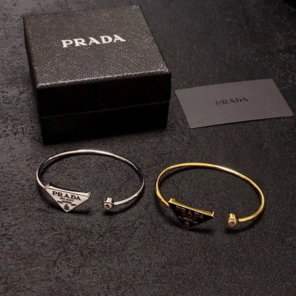 Prada Eternal Gold bangle bracelet featuring minimalist design and 18K recycled gold craftsmanship.