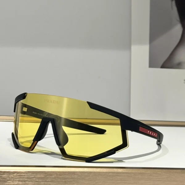 Top-down shot of Prada Linea Rossa Impavid sunglasses in silver mirror finish, laid flat with clean shadows