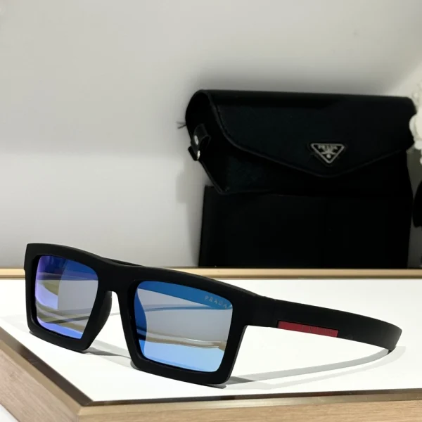 Prada Impavid sunglasses on rough stone surface under natural light, showcasing contrast between rugged and sleek design