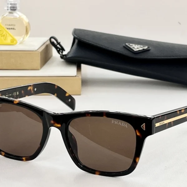 Side view of Prada sunglasses with rectangular silhouette and shiny silver metal logo plaque
