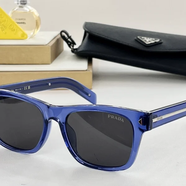 Luxury Prada sunglasses in tortoiseshell finish with bold temples adorned by a metallic Prada nameplate