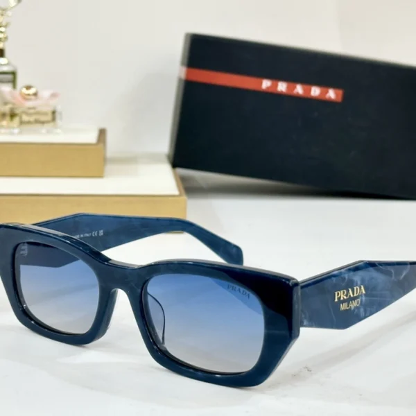 Prada sunglasses placed on a white tabletop with the Prada logo clearly visible on the side