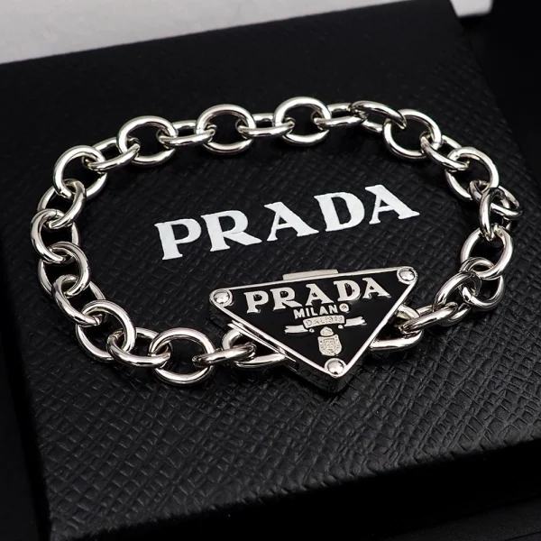 Prada Symbole bracelet in sterling silver featuring the iconic triangle logo and minimalist luxury design.