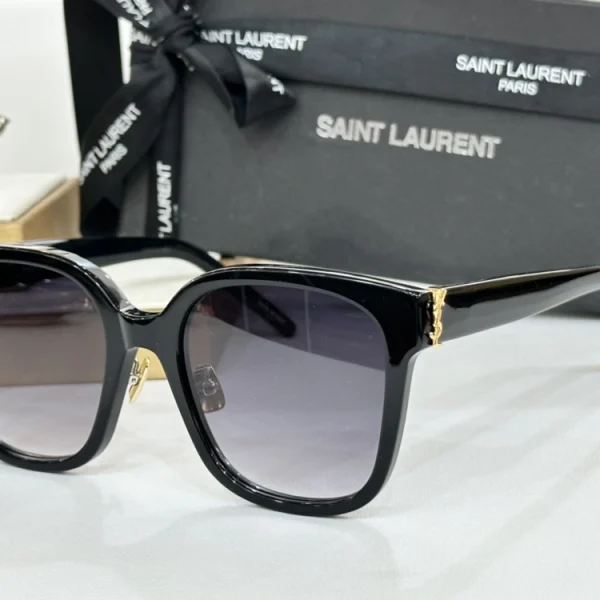 Saint Laurent Monogram SL M40 sunglasses with sleek black rectangular frame and iconic YSL monogram detail on temples