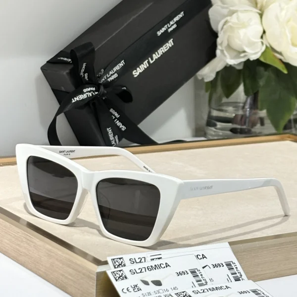 Luxury Saint Laurent SL 276 Mica sunglasses with bold black frame, paired with silver logo detail on temples