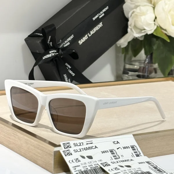 Oversized Saint Laurent SL 276 Mica sunglasses placed beside the signature Saint Laurent eyewear box