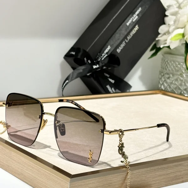 Saint Laurent SL 312 M sunglasses featuring sleek rectangular frame in polished black acetate with dark lenses