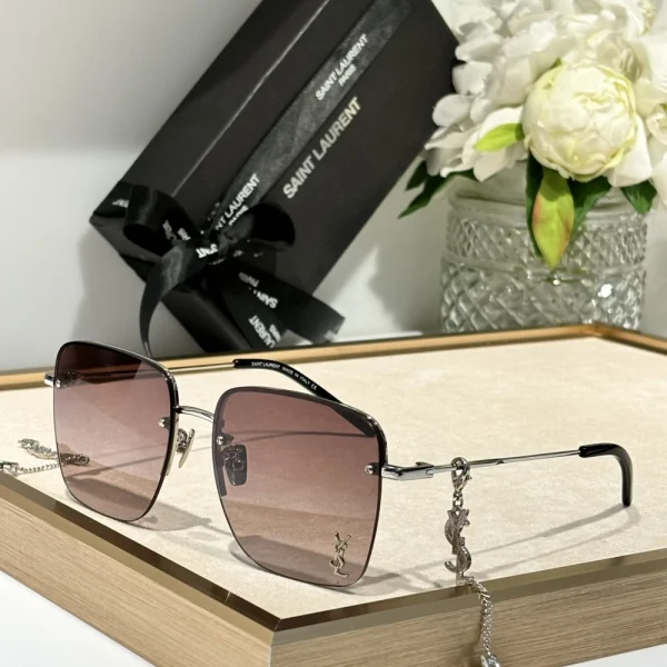 Saint Laurent SL 312 M sunglasses displayed flat with original Saint Laurent eyewear box and cleaning cloth