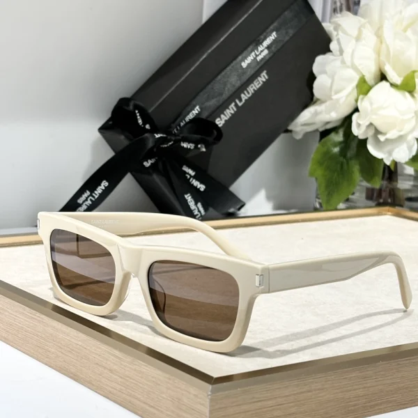 Close-up of Saint Laurent SL 461 Betty sunglasses highlighting bold temples and engraved Saint Laurent logo