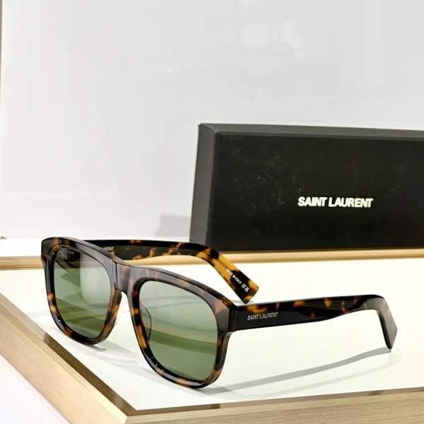 Close-up of Saint Laurent SL 558 sunglasses highlighting silver Saint Laurent logo on polished acetate temples