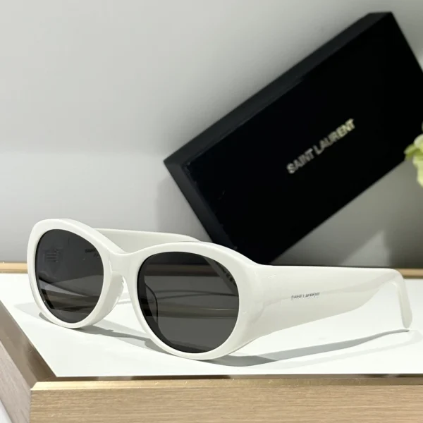 Side view of SL 736 sunglasses by Saint Laurent with thick temples and engraved logo detail in silver