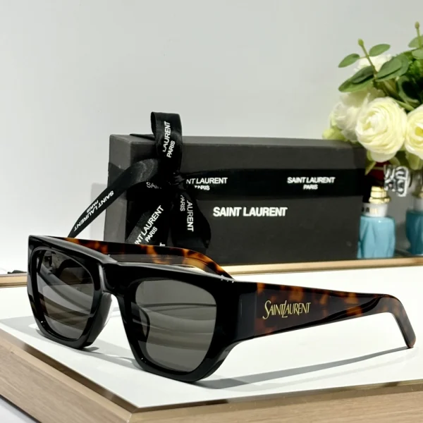 Side profile of Saint Laurent SL 740 sunglasses emphasizing bold temples and Parisian luxury style