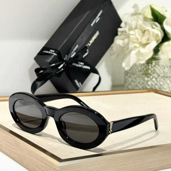 Side view of Saint Laurent SL M136 sunglasses with glossy acetate frame and subtle logo detailing