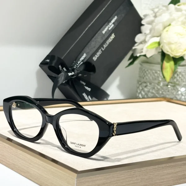 Close-up of Saint Laurent SL M148/F sunglasses highlighting silver Saint Laurent logo on wide temples