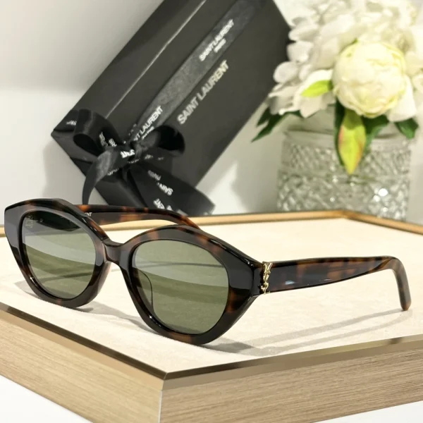 Side angle of Saint Laurent SL M148/F sunglasses showcasing sculpted temples and polished finish