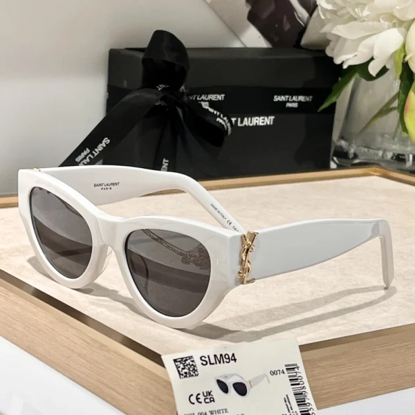 Close-up of Saint Laurent SL M94 sunglasses highlighting iconic logo engraving on thick acetate temples