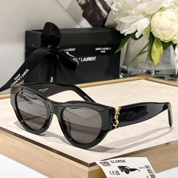 Side profile of Saint Laurent SL M94 sunglasses emphasizing strong lines and glossy black acetate