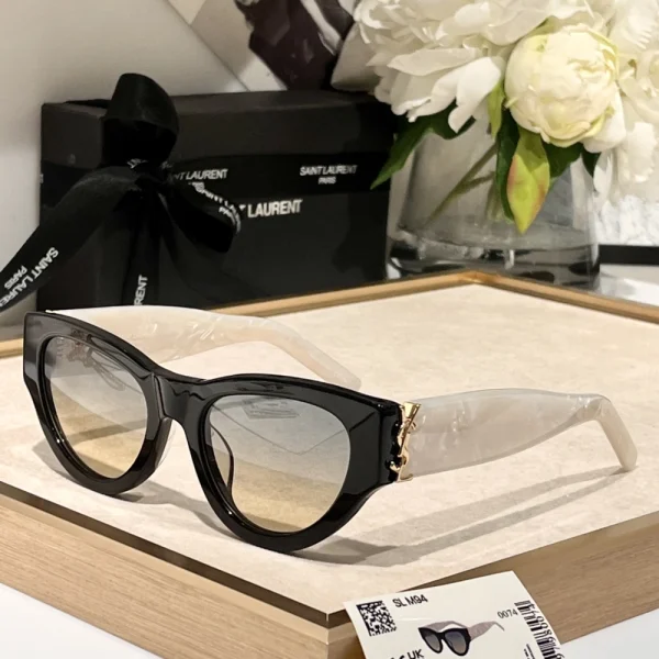 Saint Laurent SL M94 sunglasses displayed with minimalist fashion accessories for a chic Parisian look