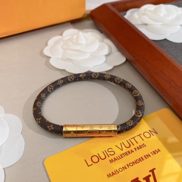 Louis Vuitton LV Bracelet crafted in polished metal with the iconic LV logo at the center