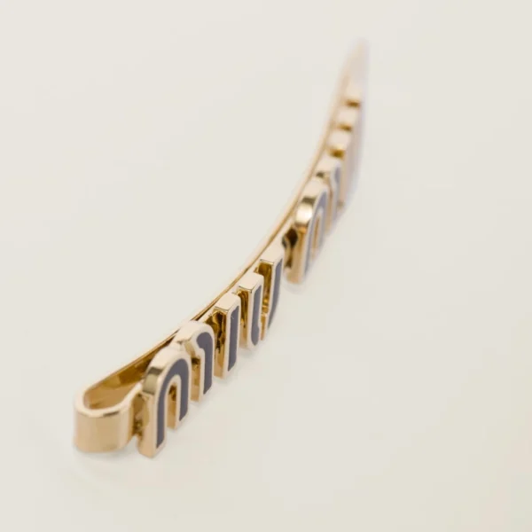 Miu Miu black enameled metal hair clip displayed on light background