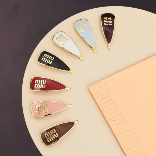 Miu Miu enameled metal hair clip with logo detail in sleek polished finish