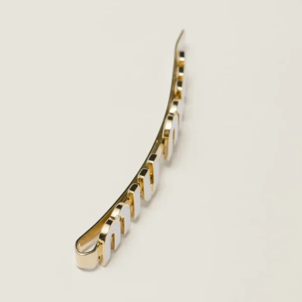 Miu Miu white enameled metal hair clip displayed on light background