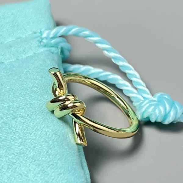 Tiffany Knot Ring displayed on finger, emphasizing elegant craftsmanship and timeless style
