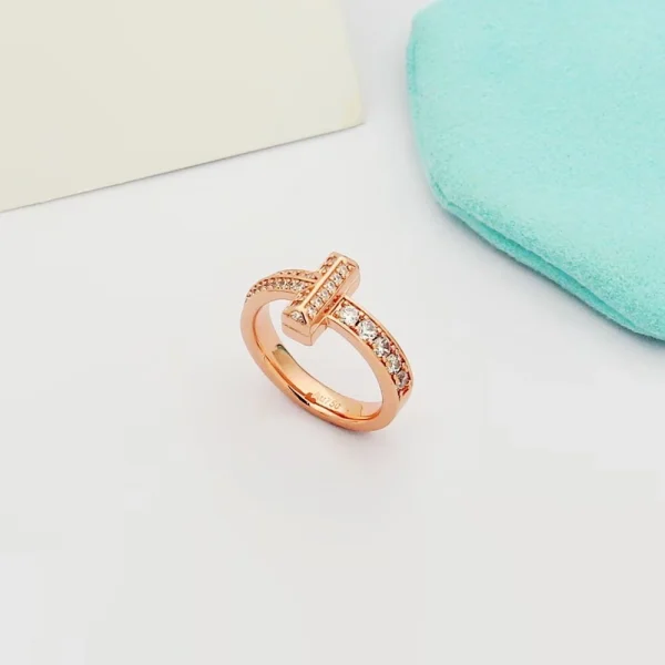 Close-up of Tiffany T T1 Narrow Ring showcasing sparkling diamonds set in polished rose gold band