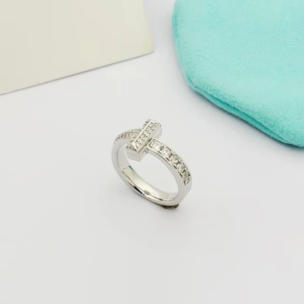 Close-up of Tiffany T T1 Narrow Ring showcasing sparkling diamonds set in polished white gold band