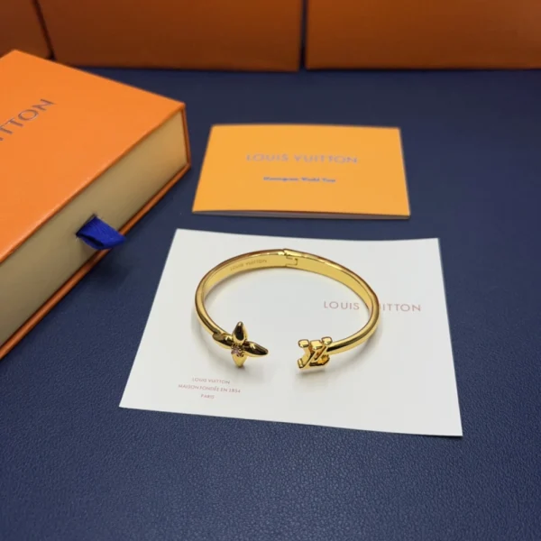 Louis Vuitton Louisette Signature Bracelet in Gold – Elegant designer bracelet for fashion lovers